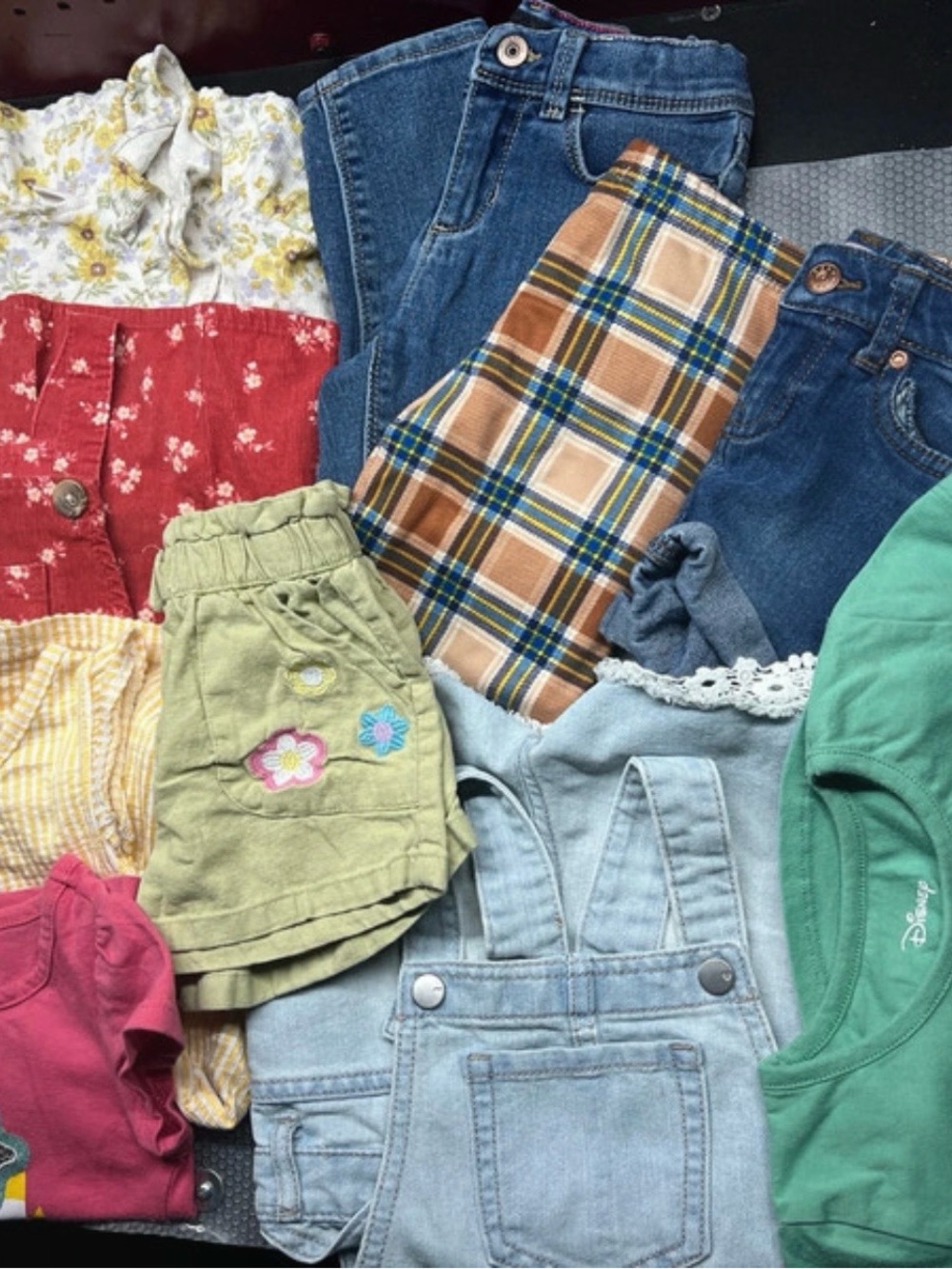 A 10-piece clothing set for girls from various brands.